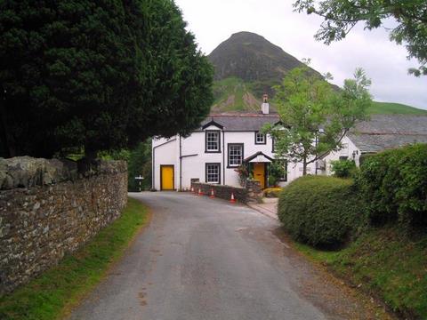 The Kirkstile Inn at Loweswater under brooding Mellbreak Fell